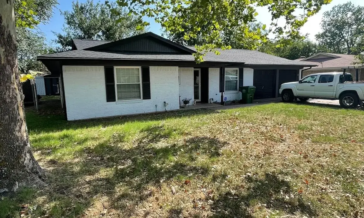 Professional roofing crew working on a residential roof in South Salt Lake